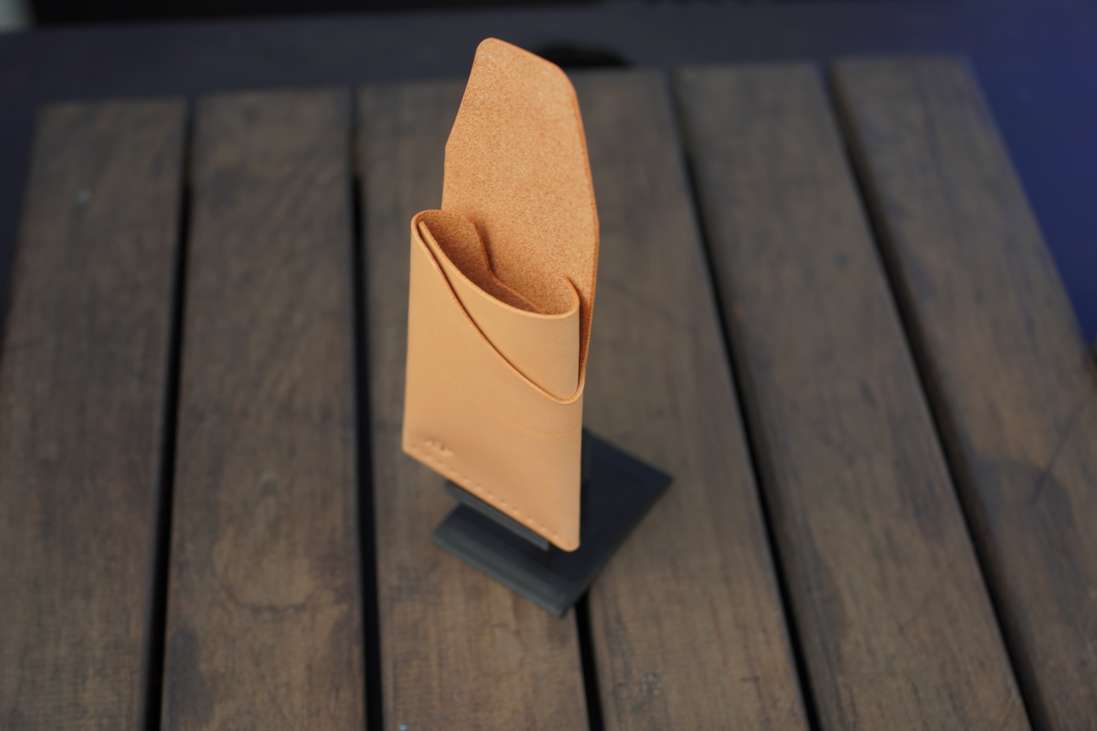 Tauruscamp leather wallet on display stand
