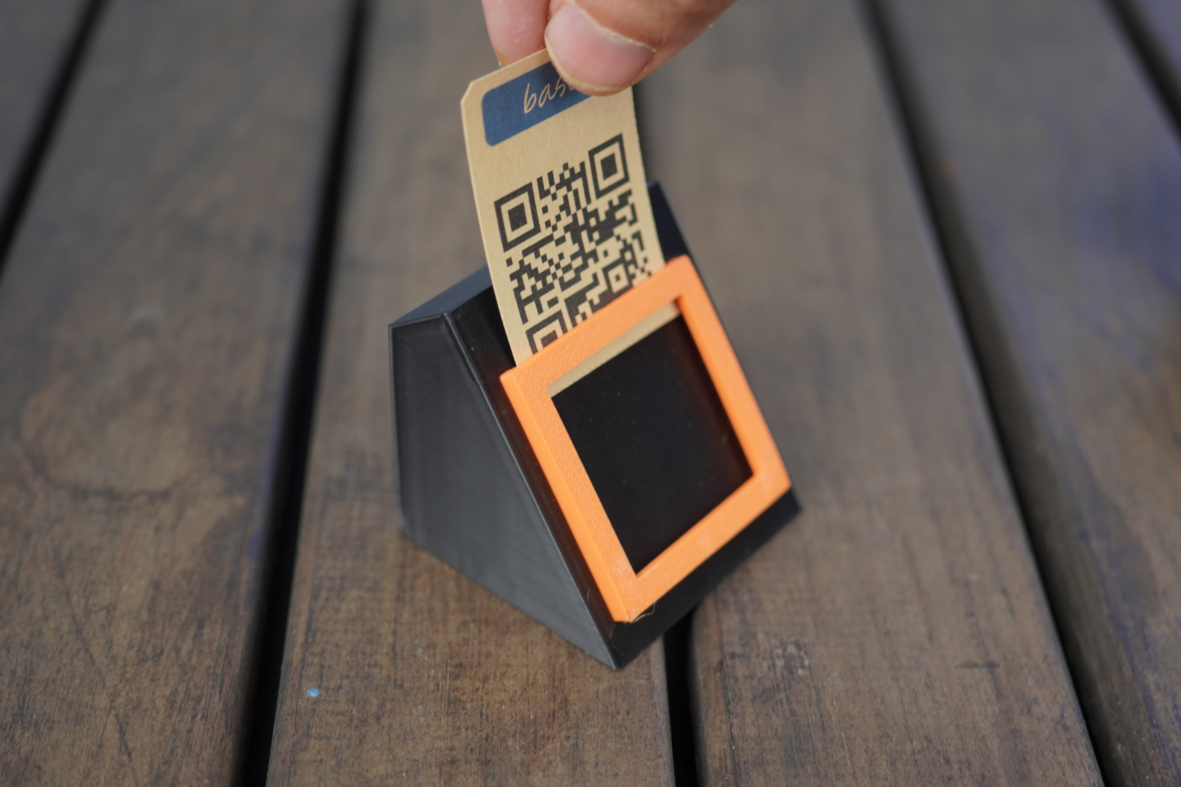 QR display holder with product card being inserted