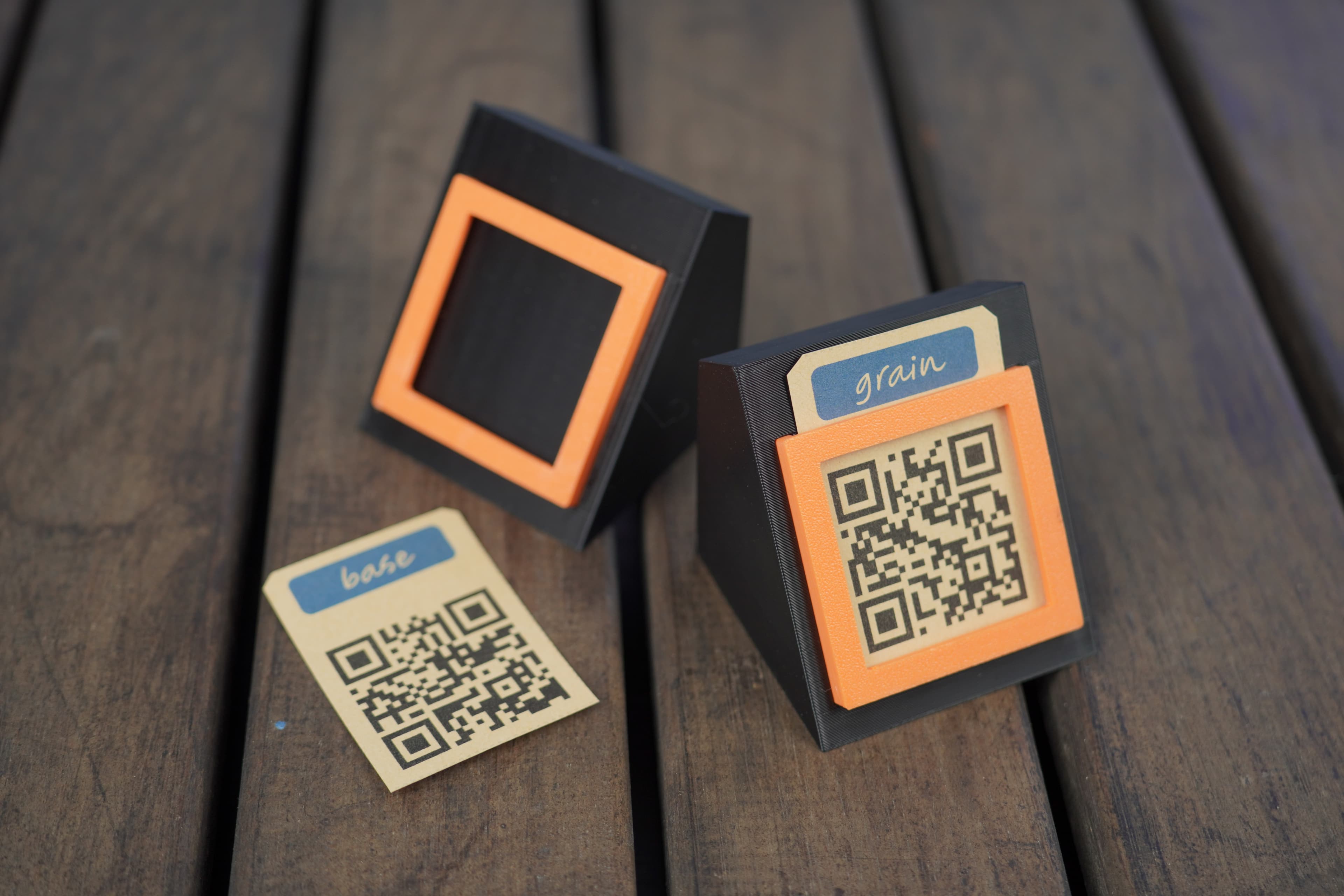 Two Tauruscamp QR display holders with product cards